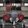 104th Fighter Wing hosts Springfield Chamber of Commerce Breakfast A front-facing view of an F-35 Lightning II stealth fighter jet parked inside a military hangar. The aircraft has its weapon bay doors open, revealing internal bay mechanisms, and is fitted with red 'Remove Before Flight' safety covers. An American flag and a black 'WEAPONS' squadron banner are visible in the background.