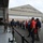 104th Fighter Wing hosts Springfield Chamber of Commerce Breakfast A group of civilian visitors is gathered outside a large military hangar belonging to the 104th Fighter Wing, Massachusetts Air National Guard. A uniformed military personnel member appears to be briefing or addressing the group, which is cordoned off by stanchion barriers. The event appears to be an organized tour or community outreach visit to the air base.