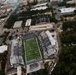 An aerial photograph of S.B. Ballard Stadium, home of the Old Dominion University Monarchs football team, located in Norfolk, Virginia. The stadium is partially filled with spectators during what appears to be a game day event, surrounded by the urban campus and residential neighborhoods. The field displays 'MONARCHS' and 'OLD DOMINION' branding clearly visible from above.