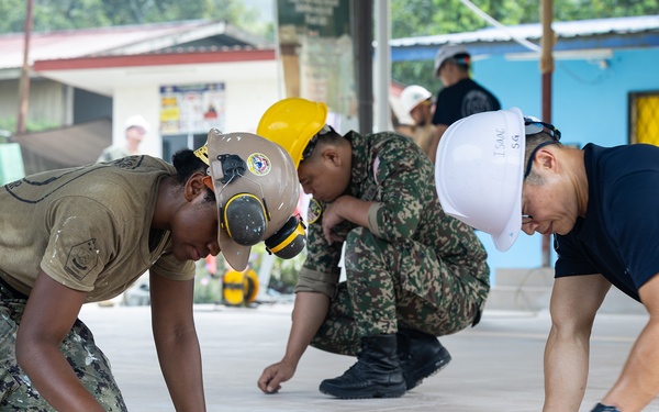 Naval Mobile Construction Battalion 5 Commander and MAF LT GEN visit Babagon Toki during PP26
