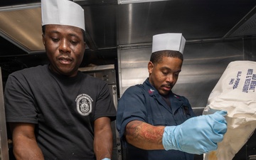 U.S. Sailors Bake in the Galley aboard Delbert D. Black
