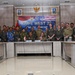 A formal group photograph of military personnel from Indonesia (TNI AU) and the United States (US PACAF) taken during the 'Cope West 26' bilateral military exercise. Personnel are posed behind a conference table in what appears to be a briefing or meeting room. The banner and table placards clearly identify the two participating nations and the exercise name.