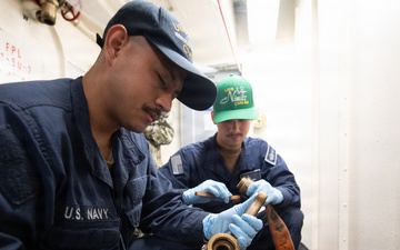 Nimitz Sailors Conduct Firehose Maintenance