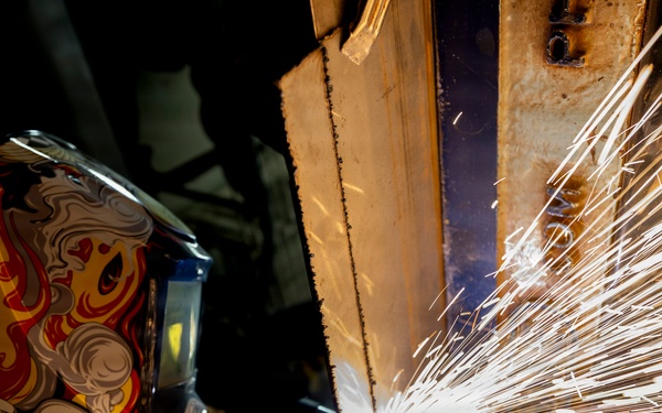 U.S. Sailors Weld aboard Delbert D. Black