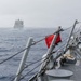 USS Mustin conducts replenishment-at-sea with USNS Wally Schirra