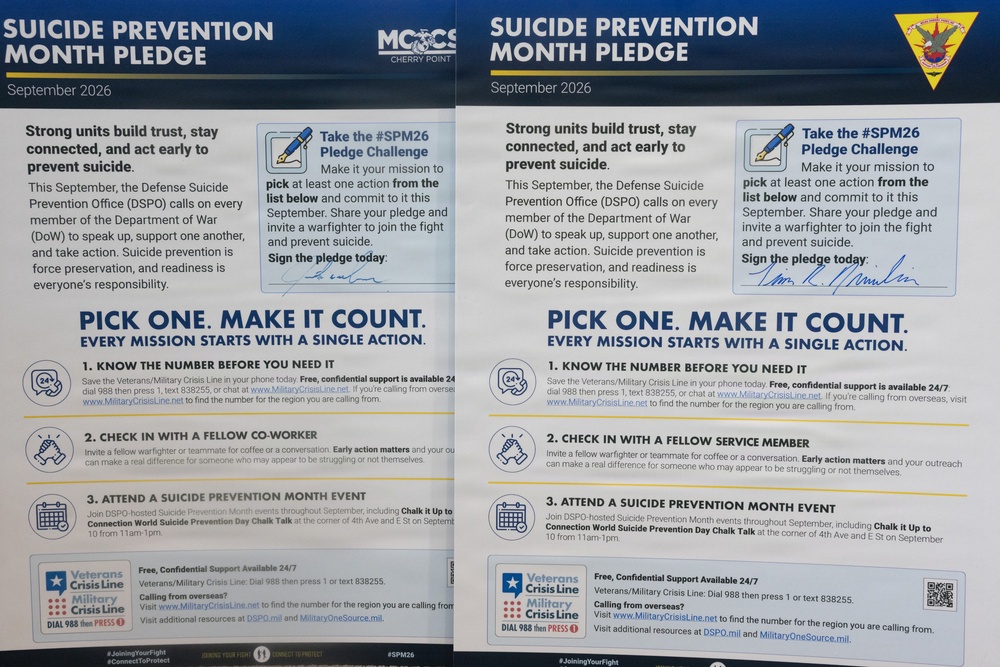 The image shows two nearly identical 'Suicide Prevention Month Pledge' flyers dated September 2026, issued by the Defense Suicide Prevention Office (DSPO). Both flyers are displayed side by side and feature the #SPM26 Pledge Challenge, encouraging military personnel to take action to prevent suicide. The right flyer appears to be associated with a military unit insignia and contains a visible signature on the pledge line.