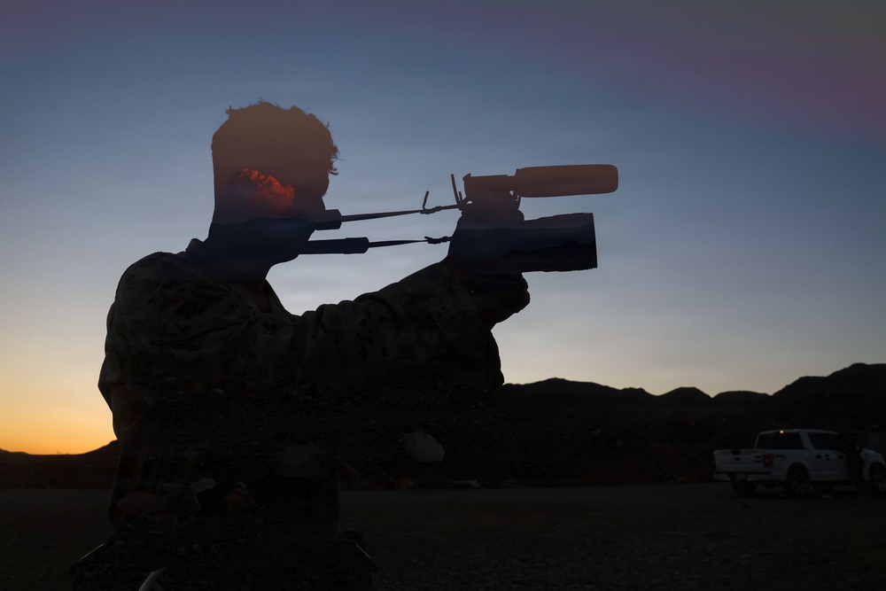 A silhouetted individual wearing camouflage clothing is aiming a scoped rifle at dusk or dawn. The scene is set in an open, arid landscape with mountains visible in the background. A white pickup truck is parked in the background to the right.