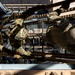 Military personnel in MultiCam/OCP camouflage uniforms are conducting a physical training or obstacle course exercise, climbing over or traversing a structure from an overhead perspective. At least one individual has a visible 'TACP' (Tactical Air Control Party) patch, identifying them as U.S. Air Force special operations personnel. The image is taken from directly above, creating a dynamic top-down composition.