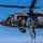 TACP Airmen master vertical infiltration Military personnel are conducting a fast-rope insertion/extraction (FRIES) training exercise from a UH-60 Black Hawk helicopter numbered 673. Multiple soldiers in camouflage uniforms and tactical gear are descending a thick rope from the hovering aircraft to the ground below. The exercise takes place over an open grassy field with trees visible in the background under clear blue skies.