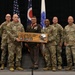 A military ceremony honoring State Command Sergeant Major William A. Workley of the Ohio Army National Guard, with six military personnel posing together holding a commemorative wooden plaque. The plaque marks his service dates from 7 February 1984 to 4 September 2026. Five individuals are in U.S. Army camouflage uniforms while one is in a Marine Corps dress uniform adorned with medals.