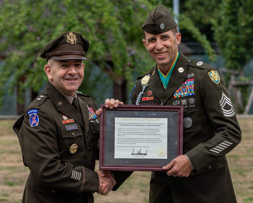 Two U.S. Army soldiers pose together holding a framed Certificate of Appreciation during what appears to be a military retirement or awards ceremony. The officer on the left, wearing two-star Major General rank insignia and a 10th Mountain Division patch, is presenting the certificate to a Master Sergeant on the right who is wearing the Medal of Honor around his neck. The certificate is addressed to Master Sergeant Caleb Barrieau, United States Army.