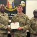 Three U.S. Army soldiers are posing for a photo at Fort Hood headquarters. The center soldier, identified by nametape as 'FAUST,' is receiving a Department of the Army certificate, likely an award or commendation. The soldier on the right is identified by nametape as 'HAYNIE.'