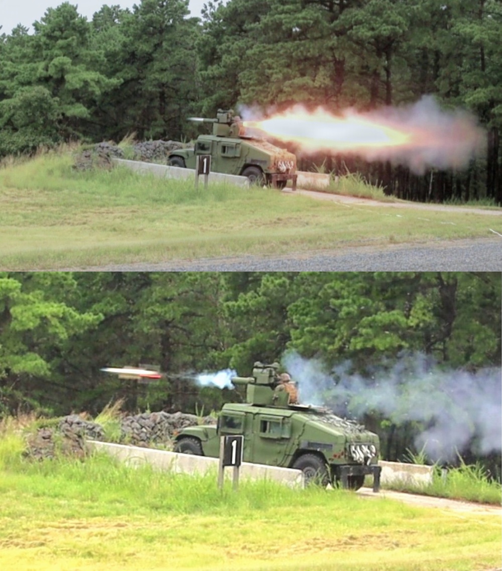 Two sequential photographs show a military HMMWV (Humvee) vehicle firing a missile or rocket from a roof-mounted launcher system. The vehicle, marked with the number '1', is positioned behind a concrete barrier with a sandbag emplacement. The images capture the launch sequence, with the top image showing the initial blast/fireball and the bottom image showing the missile in flight with exhaust trail.