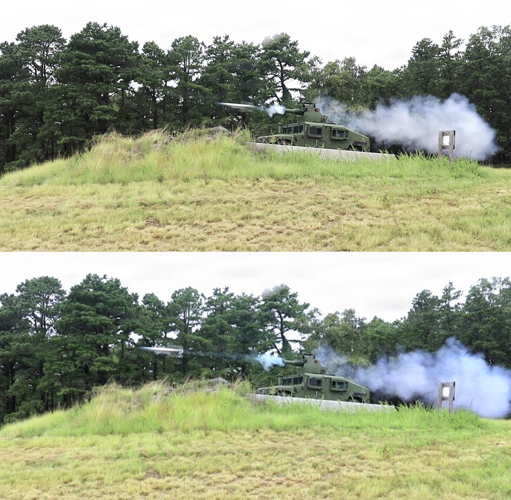 Two sequential frames showing a military vehicle firing a missile or rocket from a defilade position behind a berm or earthen mound. The vehicle appears to be a green tactical military platform equipped with a missile launcher system. White smoke and exhaust plume are visible from the launch event, with a projectile visible in flight in the lower frame.
