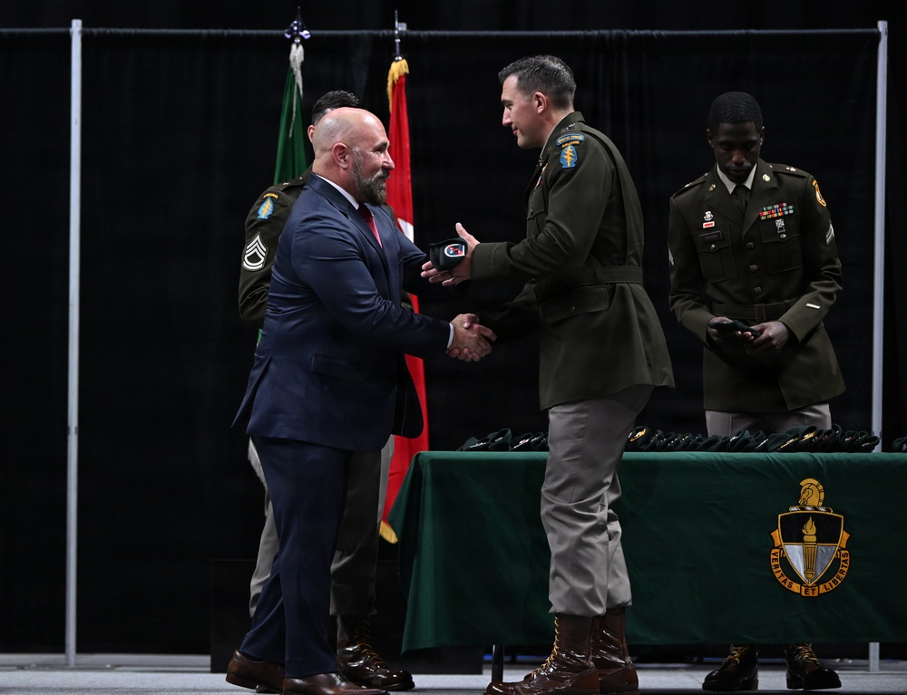 Soldiers Don Green Beret at Special Forces Graduation