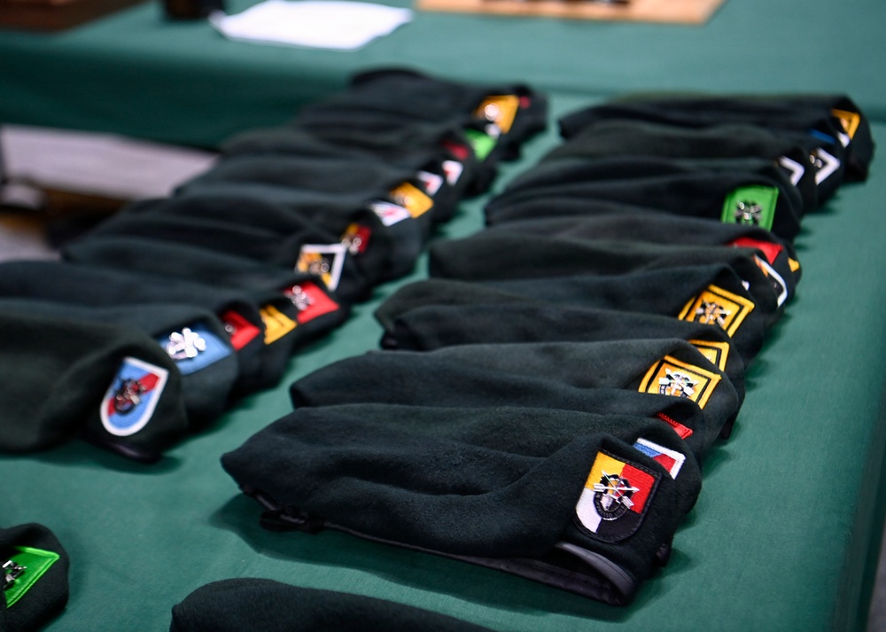 Soldiers Don Green Beret at Special Forces Graduation