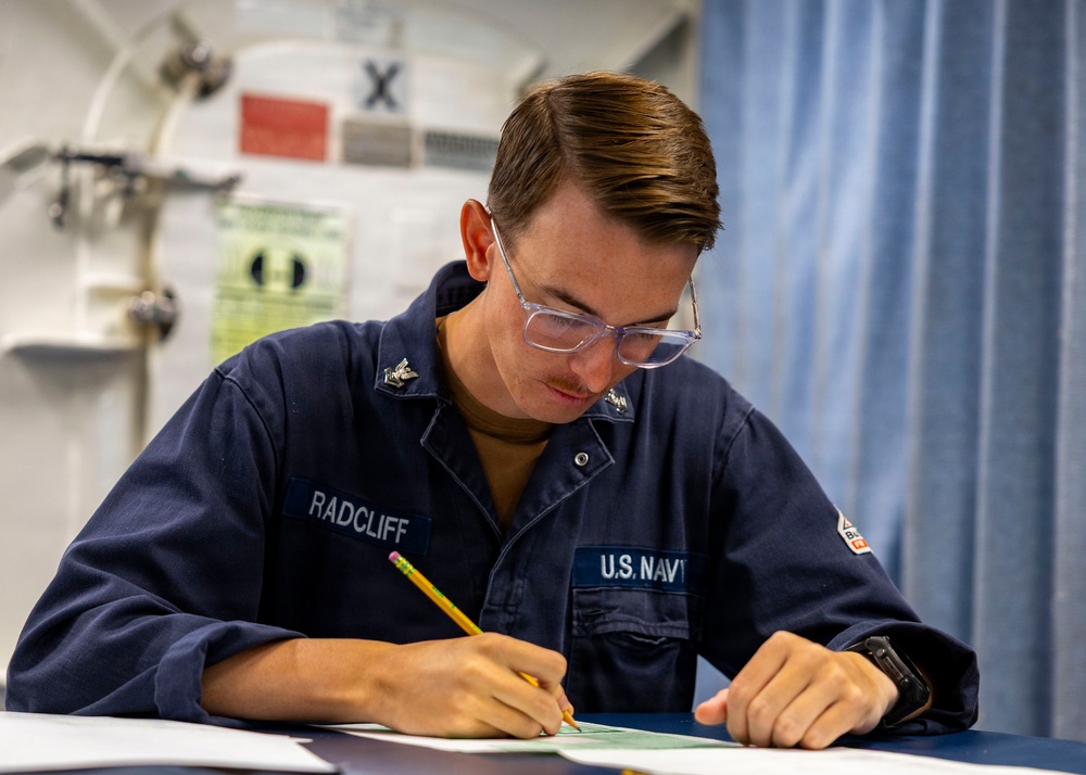 USS Benfold Sailors take the Rating-Knowledge Exam at Sea