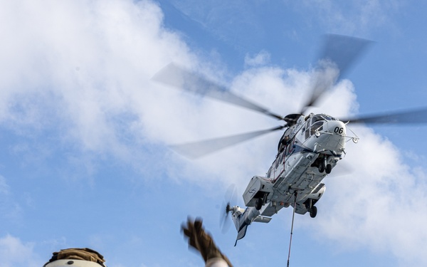 USS Mustin conducts vertical replenishment-at-sea with USNS Cesar Chavez