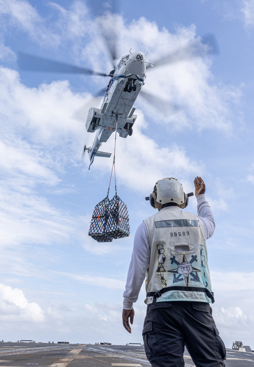 USS Mustin conducts vertical replenishment-at-sea with USNS Cesar Chavez