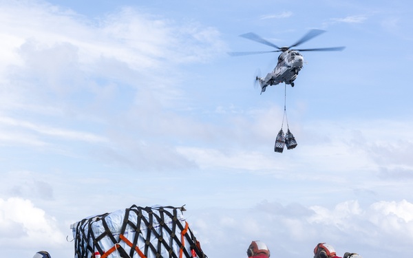 USS Mustin conducts vertical replenishment-at-sea with USNS Cesar Chavez