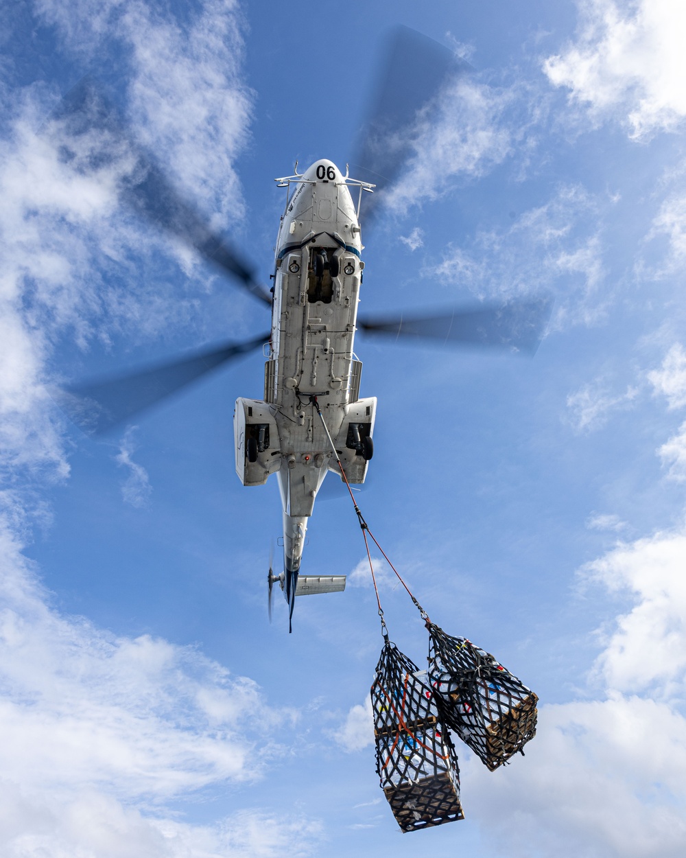 USS Mustin conducts vertical replenishment-at-sea with USNS Cesar Chavez