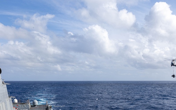 USS Mustin conducts vertical replenishment-at-sea with USNS Cesar Chavez