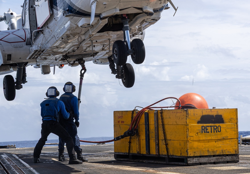 USS Mustin conducts vertical replenishment-at-sea with USNS Cesar Chavez