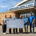 Six individuals are posing in front of Mobridge Regional Hospital &amp; Clinics holding a large ceremonial check from USDA Rural Development made out to Mobridge Regional Hospital for $41,492,000, dated 9/10/2026. The check is signed by Lorraine Polak and bears check number 15317. This appears to be a grant or loan award presentation ceremony.