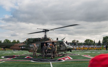 5th Bomb Wing Leadership delivers the game ball for the Prairie Warrior Bowl Military Appreciation game