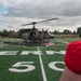 5th Bomb Wing Leadership delivers the game ball for the Prairie Warrior Bowl Military Appreciation game