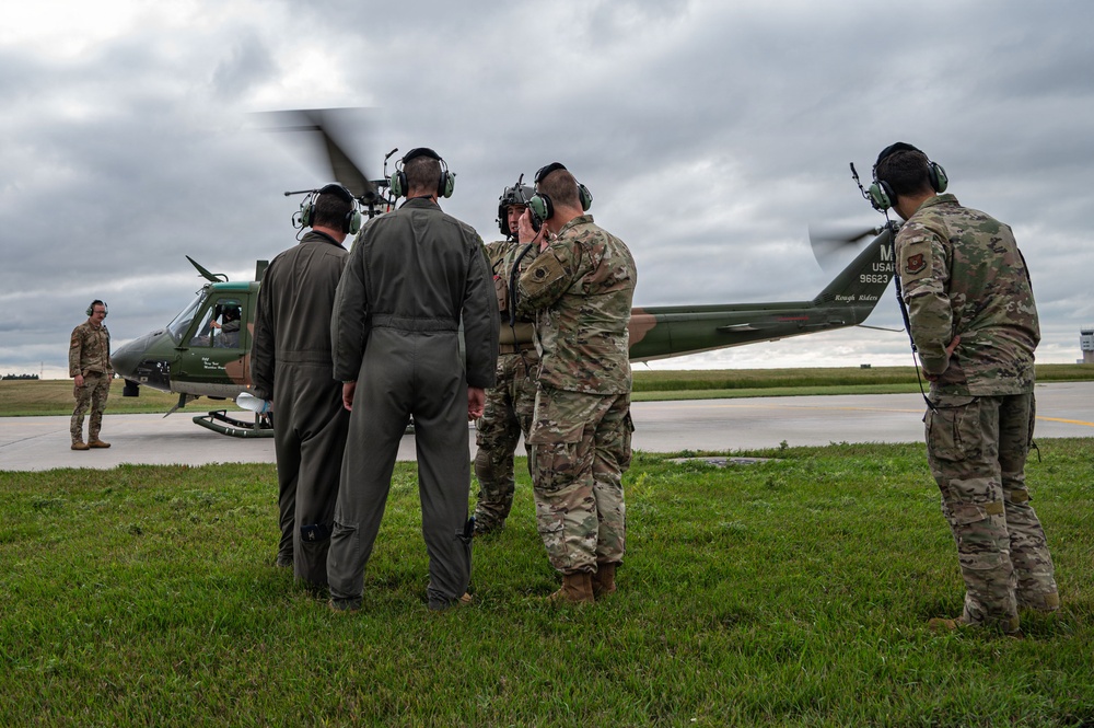 5th Bomb Wing Leadership delivers the game ball for the Prairie Warrior Bowl Military Appreciation game