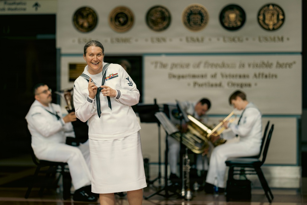 Musician 2nd Class Carrie Blosser addresses audience at the Portland Veterans Affairs Hospital