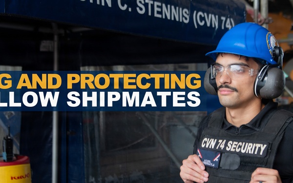 A security personnel member assigned to CVN 74 (USS John C. Stennis) is shown wearing a tactical vest labeled 'CVN 74 SECURITY', a blue hard hat, safety glasses, and hearing protection. The image appears to be an official U.S. Navy promotional or informational graphic with the overlay text 'SERVING AND PROTECTING HIS FELLOW SHIPMATES'. The setting appears to be aboard the aircraft carrier during a maintenance or industrial work period.
