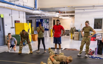 145th AW wing staff participates in combatives