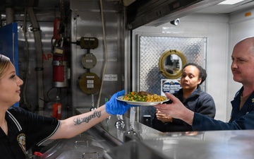 U.S. Sailor Serve Dinner Aboard USS Boxer