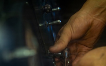 AIMD Sailor Conducts Maintenance Aboard USS Boxer