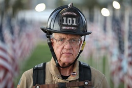 Bill Marshall stands before 9/11 Memorial