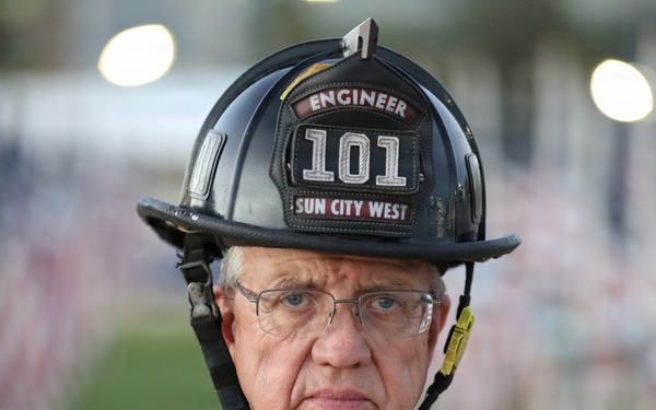 Bill Marshall stands before 9/11 Memorial