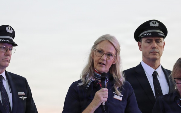 Airline crew members speak during 9/11 ceremony