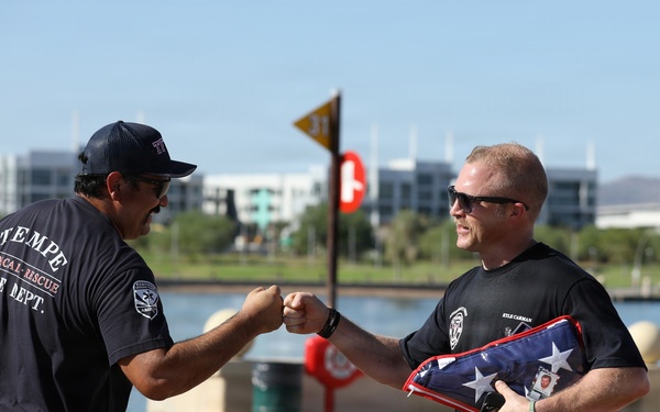 Kyle Carman fist bumps fellow firefighters