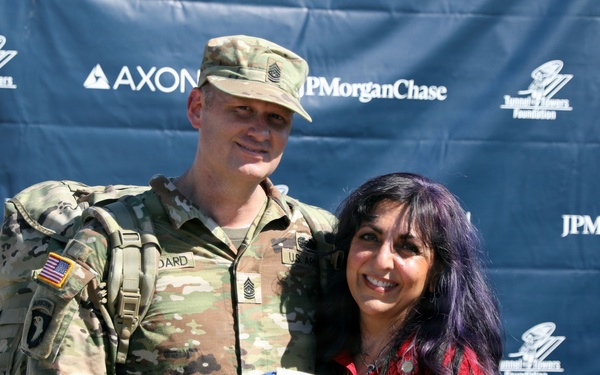 Army CSM Stoddard poses with Stella Herold at Tunnel to Towers Foundation 9/11 memorial