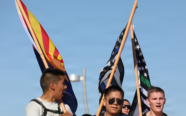 Flag-bearing runners participate in Tunnel to Towers 9/11 memorial run