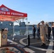 U.S. Navy Sailor Renders Salute During Ceremony Aboard Warship at Port