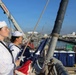 U.S. Navy Chief Selectees Stand at Attention with American Flag During 9/11 Remembrance Day at Port
