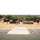 U.S., Indian Armies open training at Mahajan Field Firing Range A formal military ceremony or parade is taking place in an arid, desert-like outdoor setting. Multiple nations appear to be represented, with visible flags including those of India, the United States, and at least one other nation, along with artillery pieces and military vehicles displayed on either side. Troops are assembled in formation in front of a central stage or podium area.