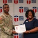 A U.S. Army soldier in camouflage uniform is receiving a Certificate of Completion from a woman in a navy blue dress at a Central Texas College event. The certificate appears to be awarded to 'Ja'Kolby Cornelius' as indicated by the soldier's name tape and the document. Both individuals are smiling and posing in front of a Central Texas College branded backdrop.