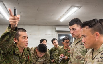 Japanese and U.S. Service Members Discuss Operations During Exercise Orient Shield