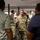 Lt. Gen. Stanton visits DISA Montgomery A U.S. Army soldier with the name tape 'STANTON' and 'U.S. ARMY' visible on their OCP (Operational Camouflage Pattern) uniform is speaking and gesturing to a group of people in what appears to be an indoor office or briefing room. The soldier appears to be addressing a mixed group of military and civilian personnel. The setting suggests an official briefing, tour, or meeting event.