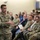 Lt. Gen. Stanton speaks at DISA Headquarters A U.S. Army officer with the name tape 'STANTON' and three stars on his collar is addressing a mixed audience of military personnel and civilians in what appears to be a briefing or town hall setting. The speaker wears an OCP (Operational Camouflage Pattern) uniform with a 101st Airborne Division patch and a U.S. flag patch on the left shoulder. The audience is seated in rows and appears attentive.