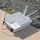 xTechAutonomy Phase II Live Demonstrations The image shows a white outdoor networking or wireless communication device branded 'snickerdoodle' placed on a concrete surface next to a gravel area. The device features multiple antennas extending from its body, along with cables and connectors attached to its side. It appears to be a ruggedized, weatherproof enclosure designed for outdoor deployment.